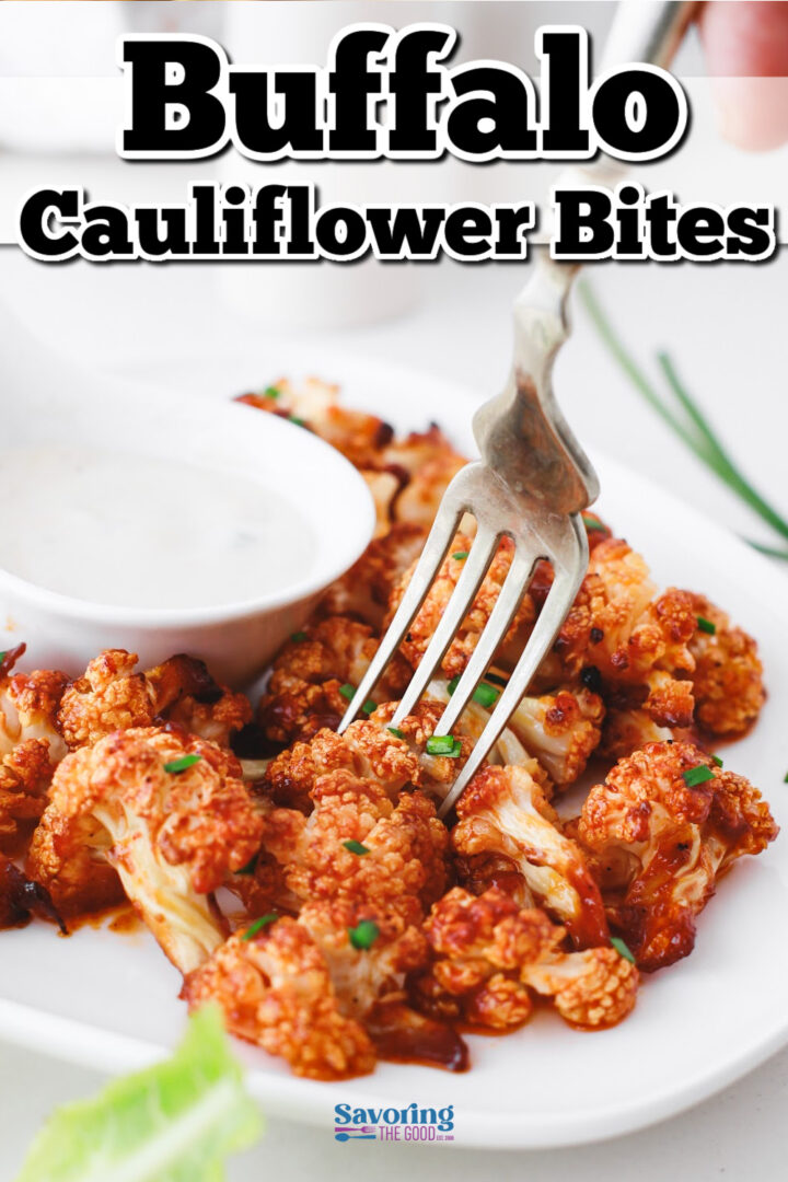 A plate of buffalo cauliflower bites with a fork and a side of ranch dip.