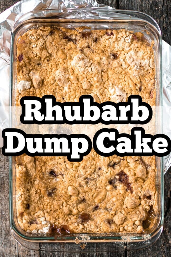 A glass baking dish filled with crumbly rhubarb dump cake, set on a wooden surface, with text overlay reading "Rhubarb Dump Cake.