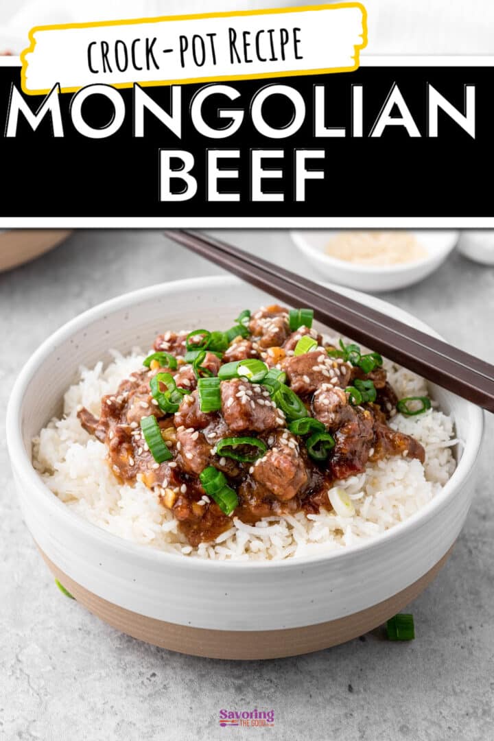 A bowl of Mongolian beef served over white rice, garnished with chopped green onions and sesame seeds, with chopsticks resting on the bowl.