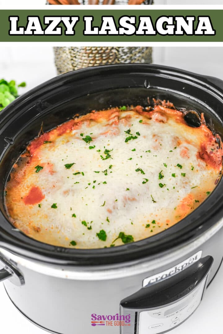 A slow cooker filled with cooked lasagna topped with melted cheese and parsley, labeled "Lazy Lasagna.